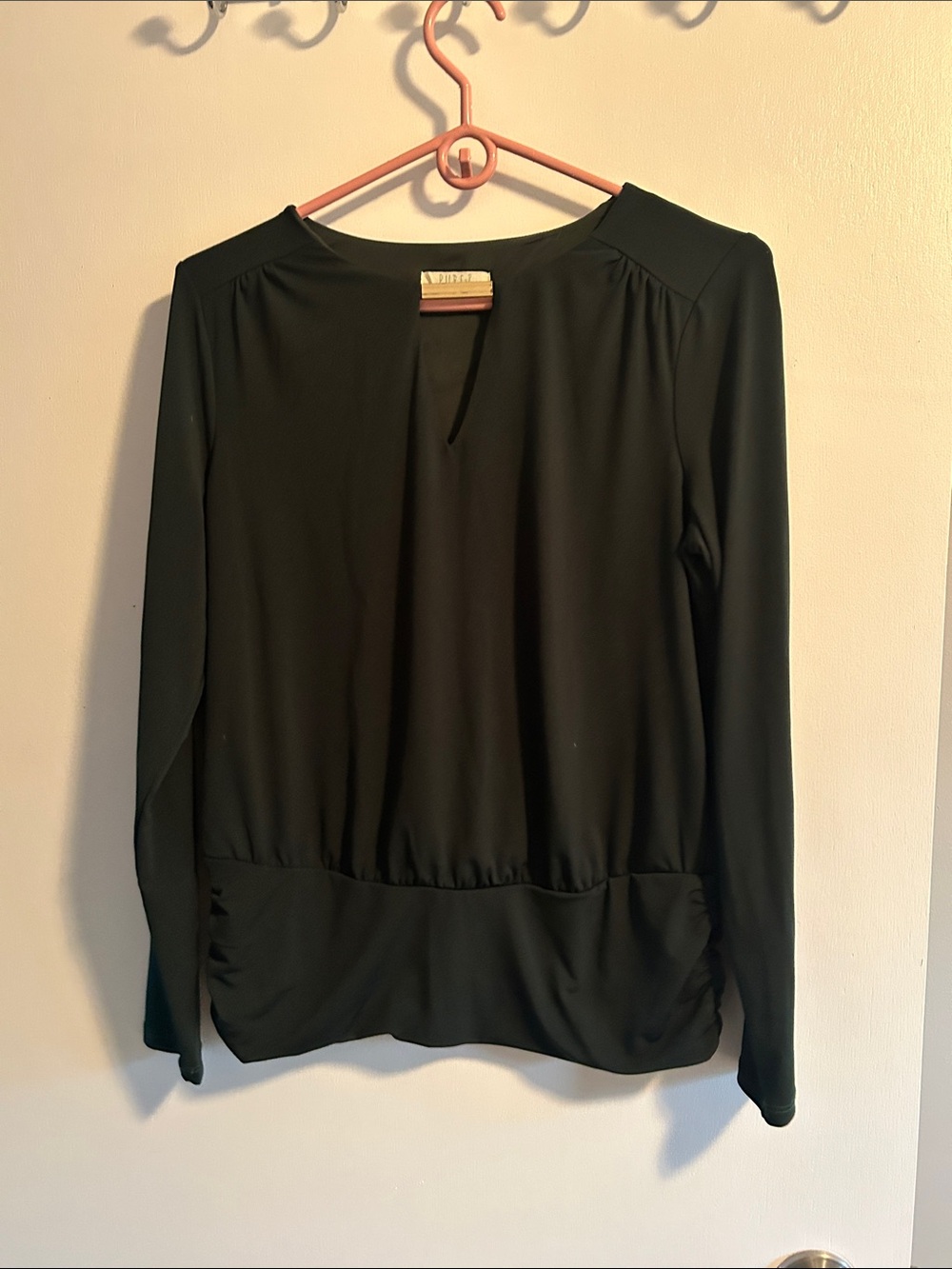 Classic dark green Long-Sleeve Women’s Top with gold accent bar